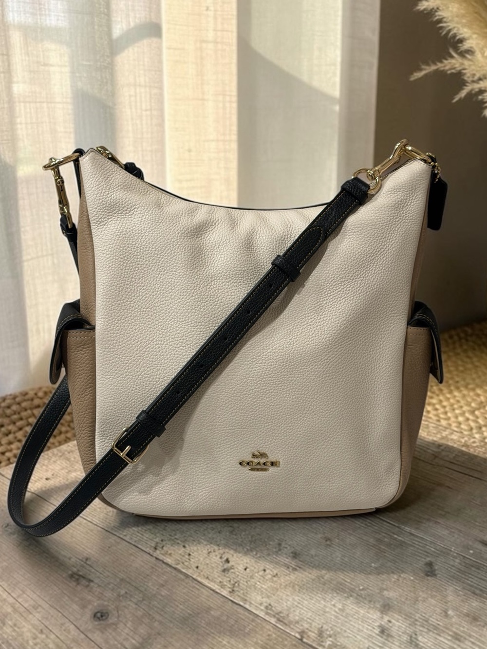 Coach Two-Tone Pebbled Leather Hobo Bag in Beige and Black